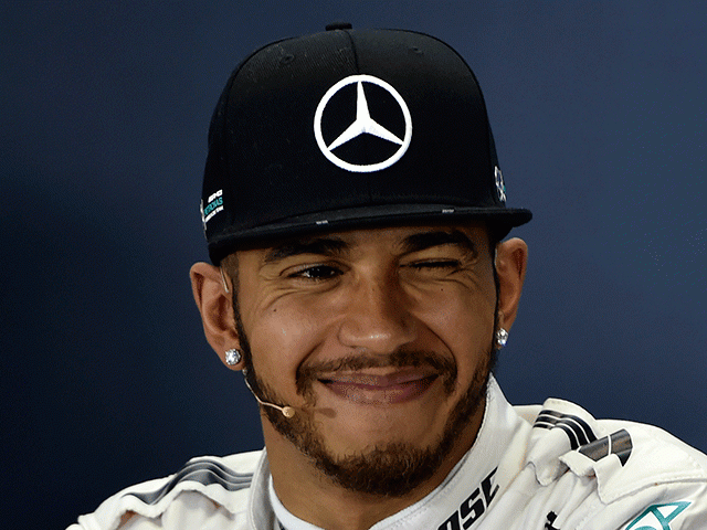 A smiling Lewis Hamilton secured another pole