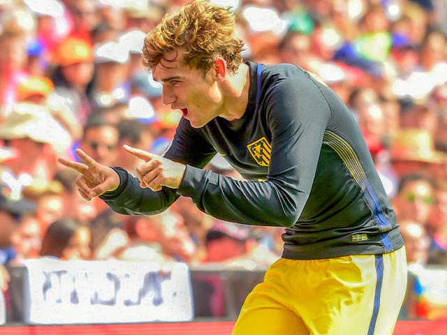 Will Antoine Griezmann be celebrating after Atletico Madrid's match with Bayer Leverkusen?