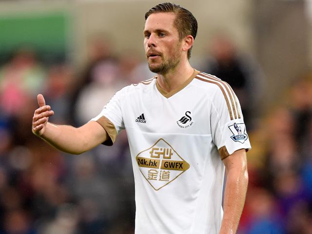 Swansea moved six points clear of the relegation zone with victory at Arsenal on Wednesday