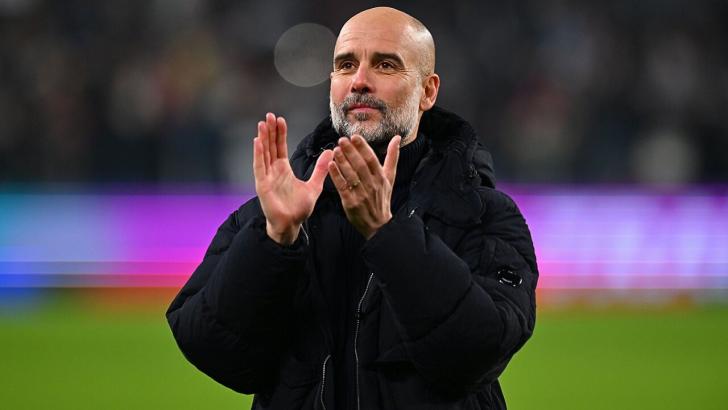 Pep Guardiola claps the fans after a Man City game