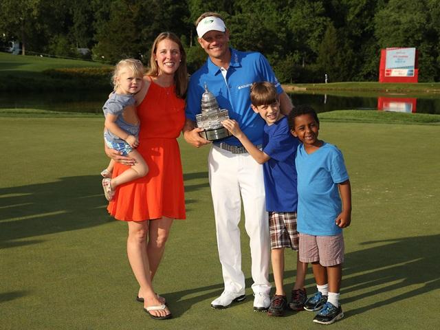 The Hurley family with the Quicken Loans trophy