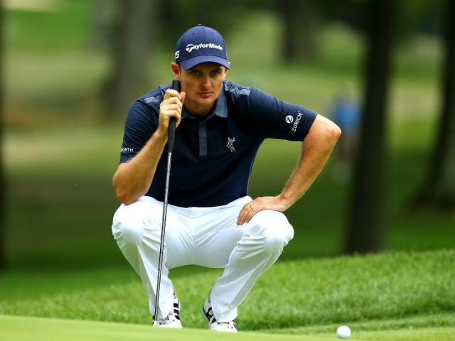 A new flame has come - Justin Rose lines up a shot hugging his new putter