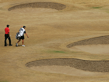 Tiger walks across a parched Hoylake in 2006 - it'll be different this time 
