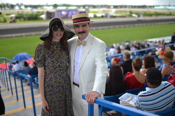 Two racegoers at Woodbine, one dressed as Hercule Poirot 