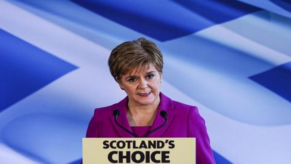 Nicola Sturgeon and Scots flag.jpg