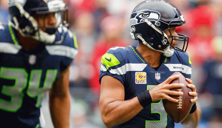 Hawking his wares: Russell Wilson has been carrying his teammates this term, but the pressure could tell here